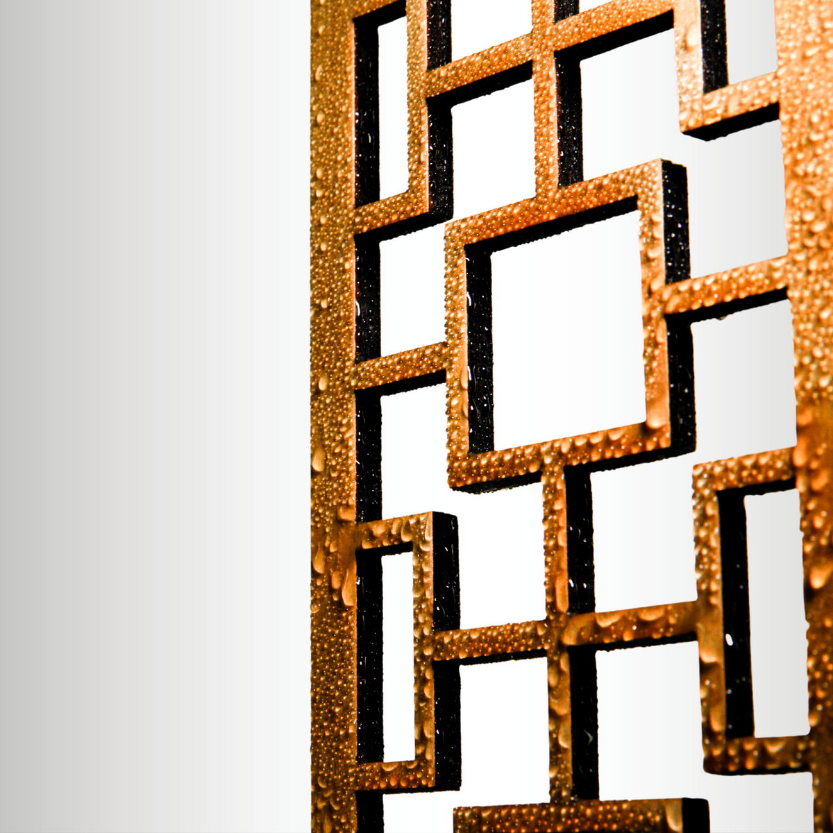 Close-up of water beading on the sealed surface of a Tropical Squares wooden trellis